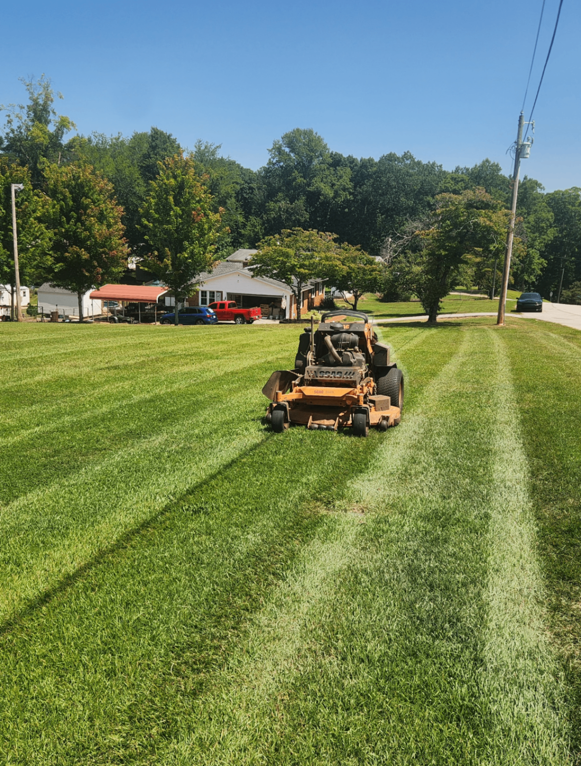 Professional mowing a beautiful lawn